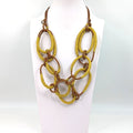Tempest Luxury necklace with metallic fabric interlinked rings UJ094N